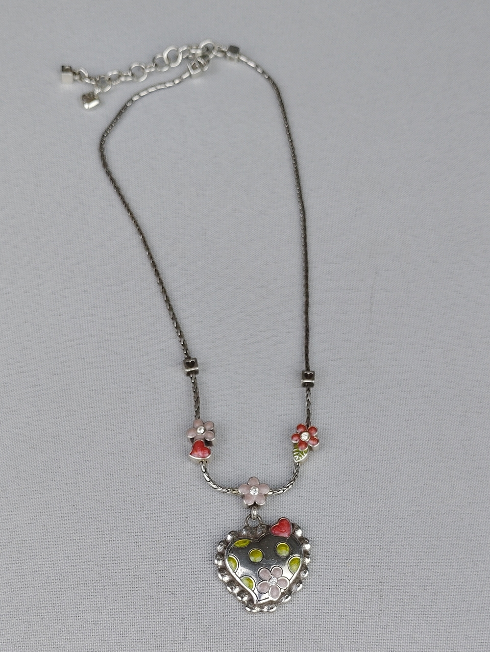 Brighton Silverplated Heart Pendant Necklace with Pink and Red Floral Accents.